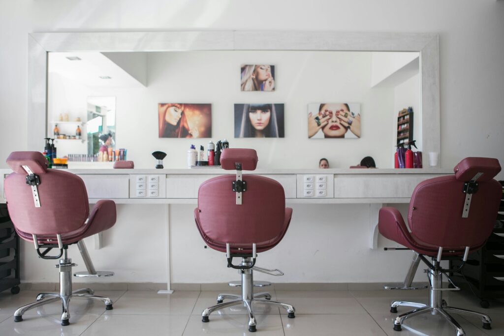 Senior hair stylist consulting with a client at Elaris Dubai luxury salon
