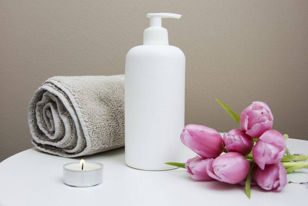 Moroccan bath ritual ingredients — black soap, kessa exfoliating glove, ghassoul clay